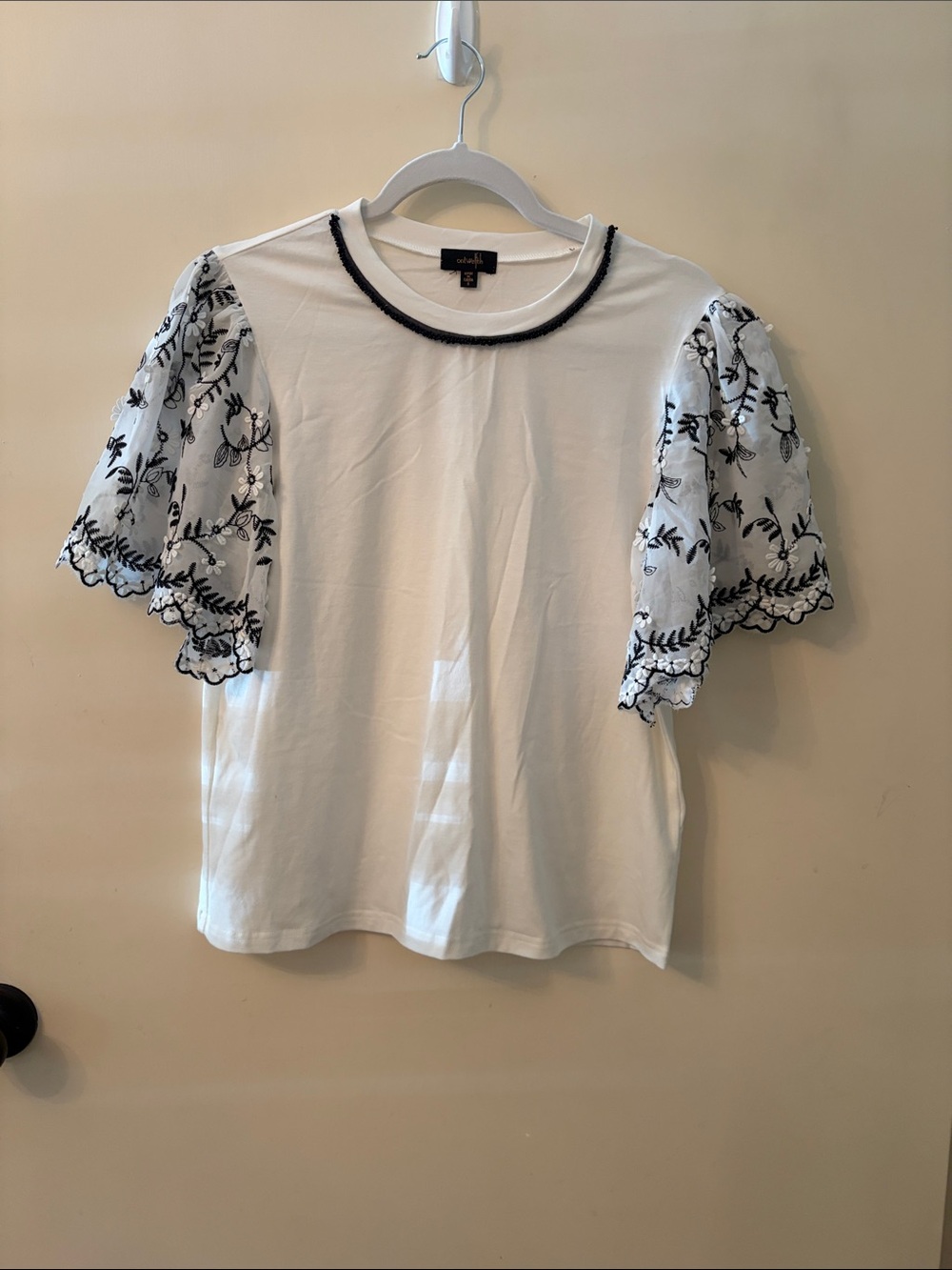 White Tee with black +white embroidered floral large ruffle Sleeve